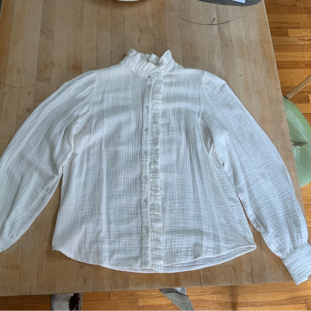 White ruffle blouse